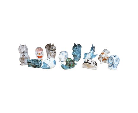 A collection of mostly Rye pottery money boxes in the form of animals together with an abstract Carltonware example, largest 