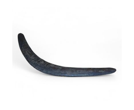 A late 19th early 20th century Australian Aboriginal boomerang, 56cm wide. Condition - good