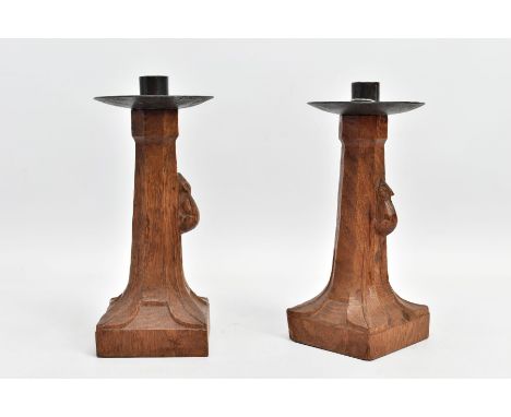 A PAIR OF ROBERT 'MOUSEMAN' THOMPSON OAK CANDLESTICKS WITH CIRCULAR WROUGHT IRON SCONCES, of octagonal form with lobed corner
