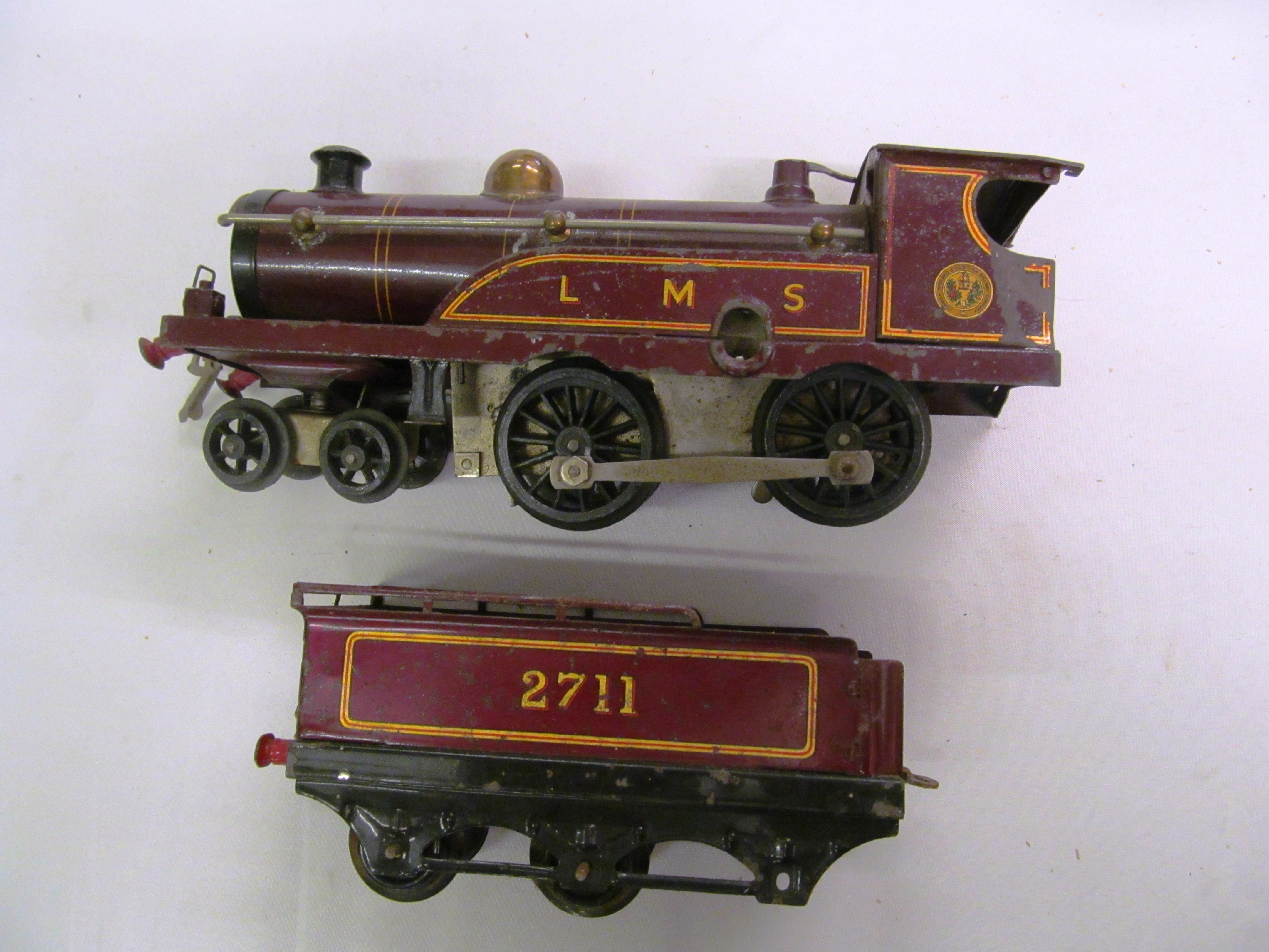 A Hornby Clockwork train set boxed with train and tender, two carriages