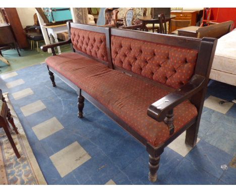 An Upholstered Pub Settle with Button Back and Scrolled Arms, 240cm 