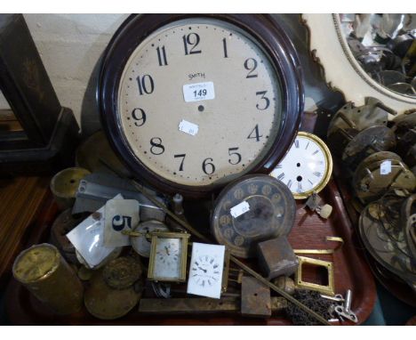 A Collection of Various Clock Parts Including Miniature Carriage Clock Movements, Weights, Pendulum Etc
