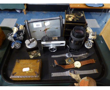 A Tray of 1960's Curios to Include Alarm Clock with Clockwork Movement, Wristwatches, Table Lighter