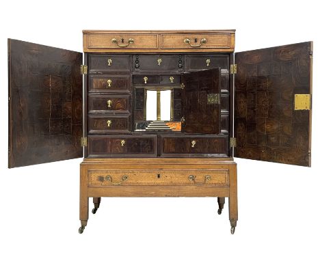 Mid-18th century walnut collectors cabinet on stand, rectangular banded top over two drawers with chequered stringing, the ca