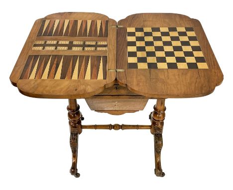 Victorian walnut games table, shaped fold-over and swivel top with chess, cribbage and backgammon boards, single drawer with 