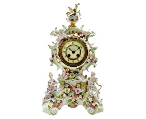 Mid-19th century continental porcelain mantle clock in the Meissen Rococo style decorated with encrusted flowers throughout a