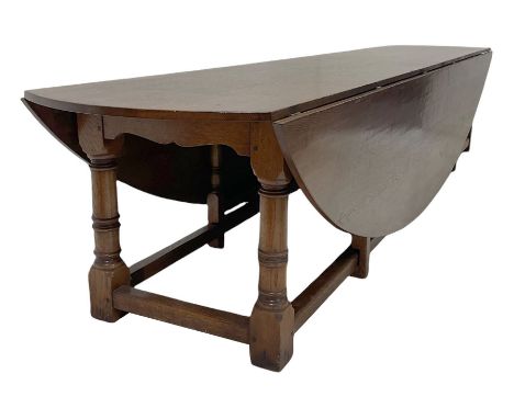 Large 17th century style oak dining wake table, the drop leaf top over gate leg action W397cm, H77cm, D215cm Condition Report