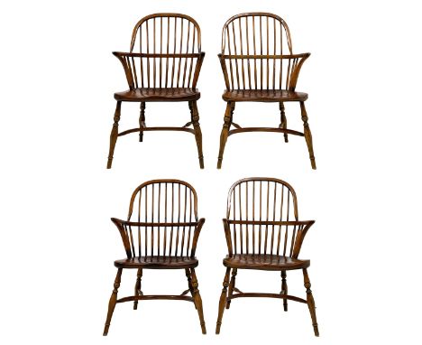 Set of four elm and oak Windsor armchairs, double hoop and high comb back, dished saddle type seat, on turned supports joined