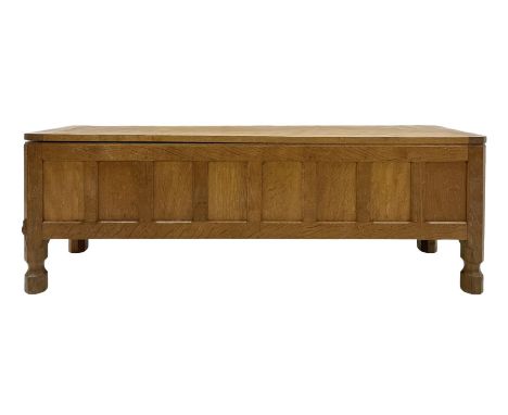 'Mouseman' oak blanket chest, rectangular adzed hinged lid over panelled front, panelled sides and back, on octagonal feet, b