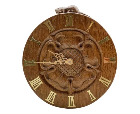 'Beaverman' carved oak wall clock with a central carved Yorkshire Rose and brass Roman numerals, Quartz movement, by Colin Al