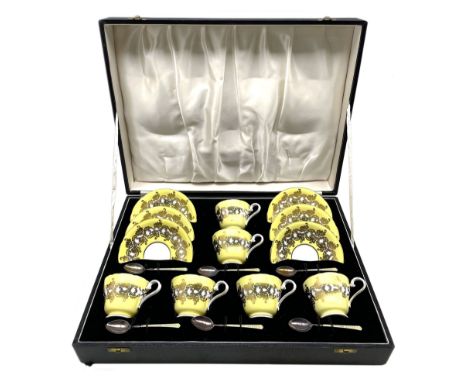 1950's cased set of six Aynsley cups and saucers, yellow and gilt decorated with a set of six silver guilloche enamel teaspoo