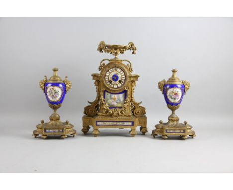 Clock garniture with blue porcelain mounts.   