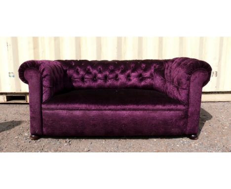 Purple Chesterfield sofa. .   