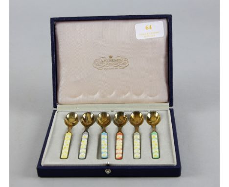 Cased set of six Danish sterling silver gilt and enamel floral design spoons in six colours by A Michelson .   