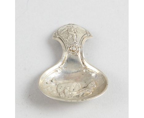 Dutch silver caddy spoon with rural scenes .   