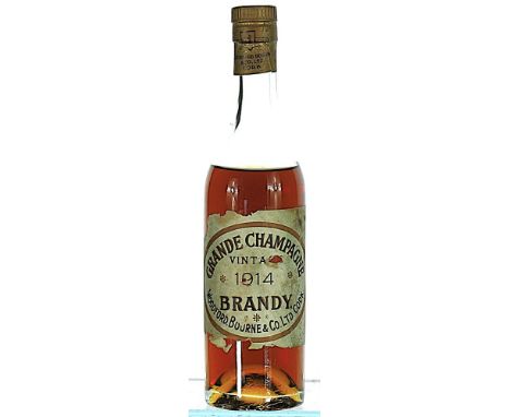 1914 Woodford, Bourne & Co., Grande Champagne Brandy 1x50cl  Bottled by Woodford, Bourne & Co. Ltd., Cork.  Label damaged.