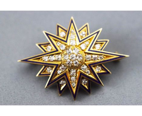 A yellow metal star brooch set with old cut diamonds, approx total weight of 1.25 carats. Finished with blue enamel to edge a
