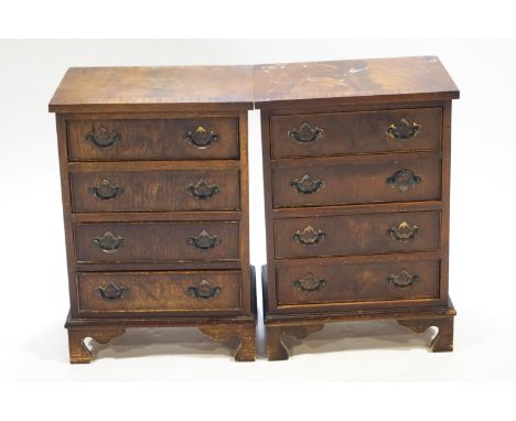 A pair of bedside chests in mahogany veneer set four drawers on bracket feet, 63cm high