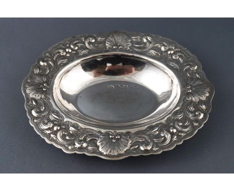 A silver bon bon dish of oval form, the edge chased with shells and scrollwork, by Walker and Hall, Sheffield 1893, 15cm wide