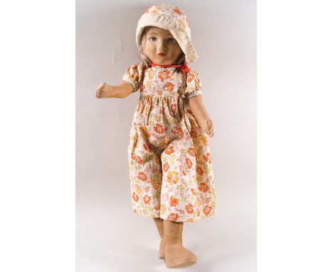 A Chad Valley doll, in the form of a young girl wearing a flower, hat and dress, 42cm high, together with a large Plush cover