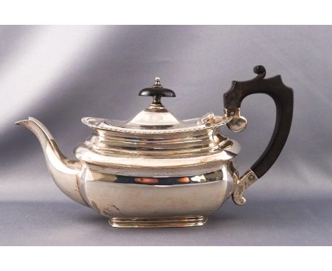 A silver bachelor teapot of belled rectangular form with gadrooned edge, ebony handle and knop, marks rubbed but Birmingham e