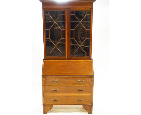 An Edwardian inlaid mahogany bureau book case with two astragal glazed doors under a plain frieze over a fall front bureau wi