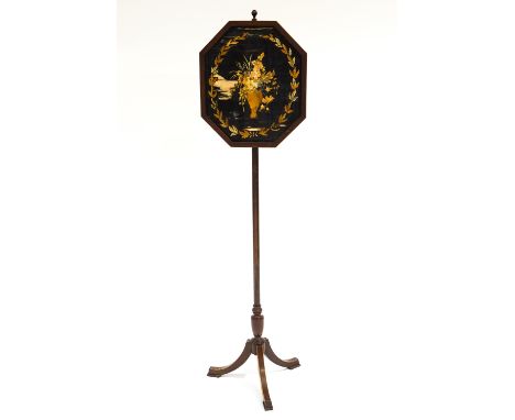 A 19th century mahogany and inlaid pole screen with an octagonal panel set a floral embroidery, on a splayed tripod base 143 