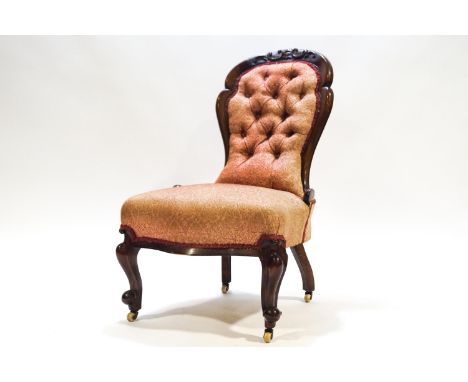 A Victorian button back nursing chair on cabriole legs, 89cm high