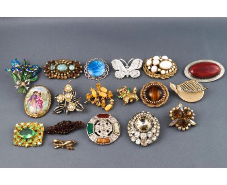 A selection of eighteen costume brooches of variable designs finished with enamel or paste stones within base metal mounts. G