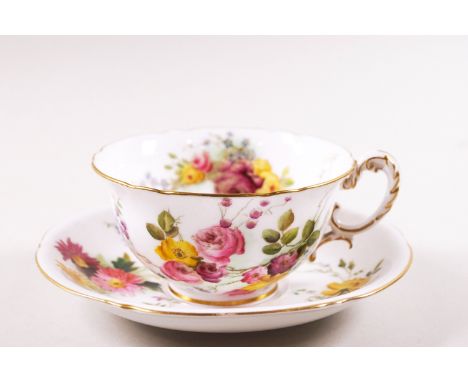 A Royal Worcester porcelain cup and saucer, printed and painted with flower sprays, puce factory marks, together with a  Dres