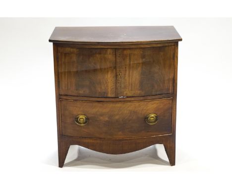 A George III mahogany commode, with bow front, 70cm high, 65.5cm wide, 38.5cm deep