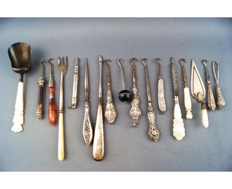 A selection of glove button hooks with silver agate and metal handles etc and a silver caddy spoon with mother of pearl handl