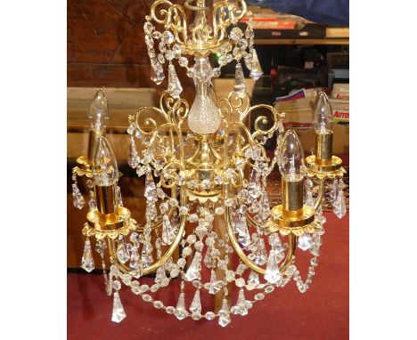 A contemporary gilt brass and cut crystal glass drop hanging ceiling light