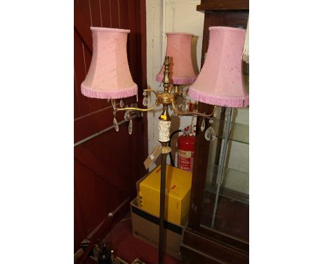 A brass standing three-branch floor light 