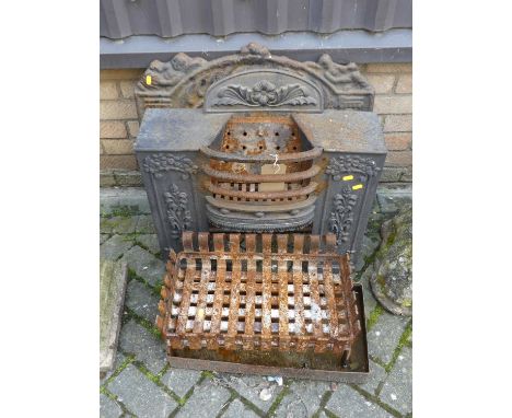 A late 19th century cast iron fire insert, together with a cast iron fire back, a cast iron fire grate, and a metal ash drawe