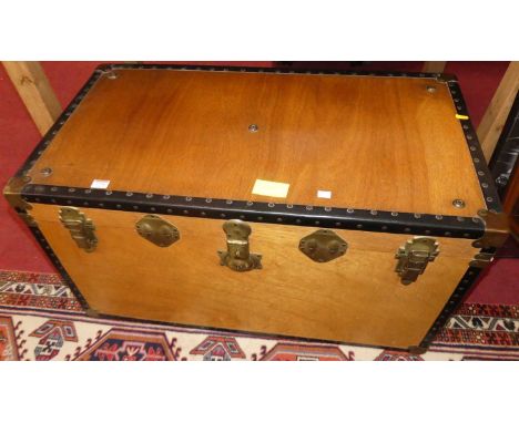 A plywood, rexine and brass mounted hinge top travelling trunk, width 92cm