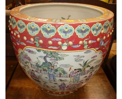 An unusually large Chinese enamel decorated stoneware fish bowl, of slightly bulbous form, the interior painted with stylised
