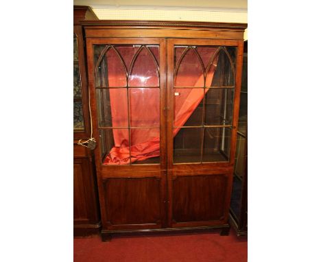 A 19th century mahogany double door side cabinet, having lancet glazed upper doors, w.139cm Column - one panel cracked. 