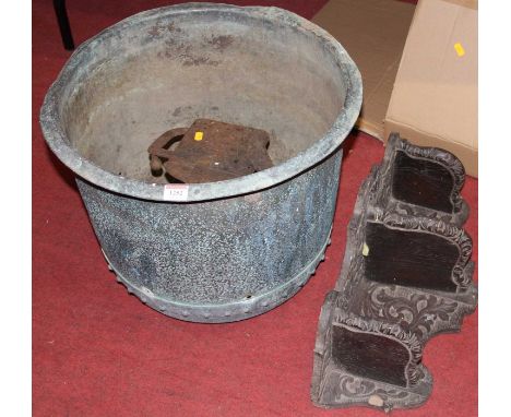 A circa 1900 circular riveted copper log bucket, dia.48.5cm; together with an iron novelty garden plant stand; and a relief c