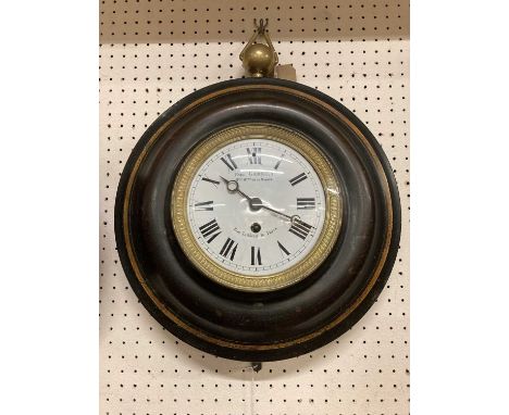 A late 19th century French Toleware circular wall clock, the white enamel convex dial signed 'Paul Garnier Rue Taitbout 16 Pa