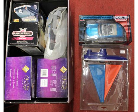 Mixed lot containing an Elvis storage box, sailing yacht, a quantity of 1/18 scale model diecast, and collectable village tea