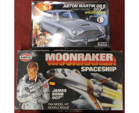 An Airfix Moonraker spaceship plastic kit, and a Doyusha 1/24 scale model of an Aston Martin DB5 007 car