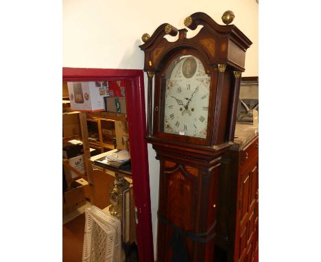 An early 19th century mahogany and satinwood inlaid longcase clock, having an arched painted dial, twin winding holes for an 