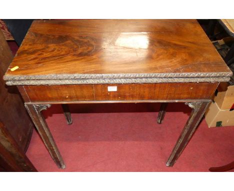 A George III mahogany fold-over baize lined card table, having rear gateleg action, flower head repeating detail, raised on m