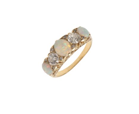 AN OPAL AND DIAMOND FIVE STONE RING. mounted with three graduated solid white opals and two circular old-cut diamonds, with r