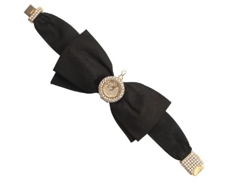 A LADY'S DIAMOND AND 18CT GOLD COCKTAIL WRISTWATCH BY CHOPARD. the dial signed Chopard, Geneve and set overall with circular-