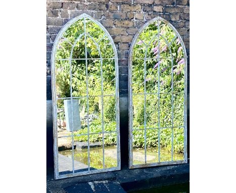 ARCHITECTURAL GARDEN MIRRORS, pair, 160cm high, 67cm wide, arched metal frames. (2) 