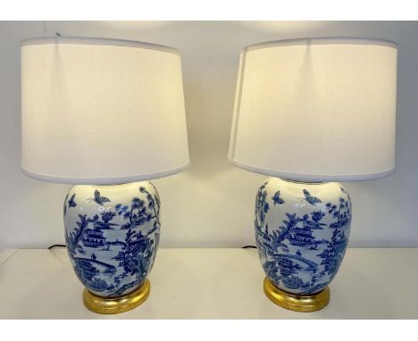 TABLE LAMPS, a pair, Chinese export style blue and white ceramic, with shades, 55cm x 35cm x 35cm. (2) 