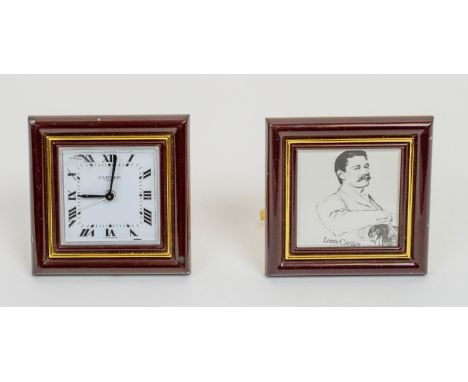 CARTIER TRAVELLING CLOCK, AND PICTURE FRAME, Le Must 1970s in burgundy enamel. (2) 8cm x 8cm 