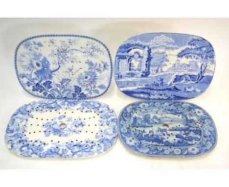 Four Staffordshire blue and white meat drainers; each one of oval form with typical reticulated design. One decorated with tw